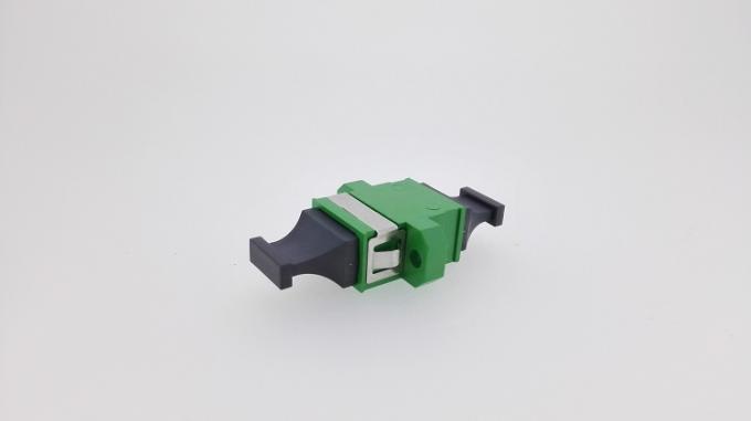 Green MPO MTP APC fiber optic adapter — side angle view showing dust caps and housing
